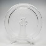 Glass turntable/cooking tray has 3 partial circles where it conne...